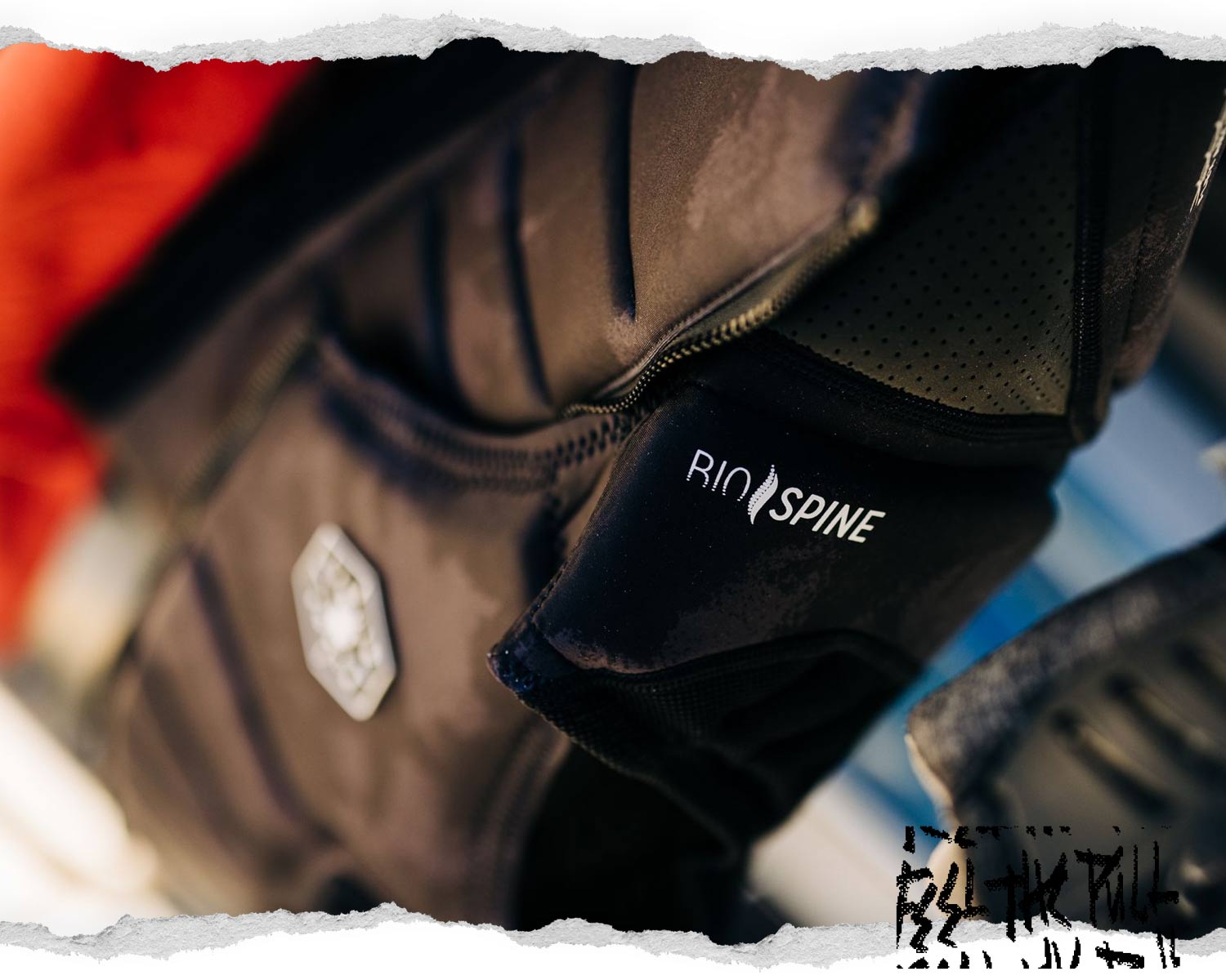 Close-up of black vest with Bio-Spine padding and Liquid Force badge in soft focus.
