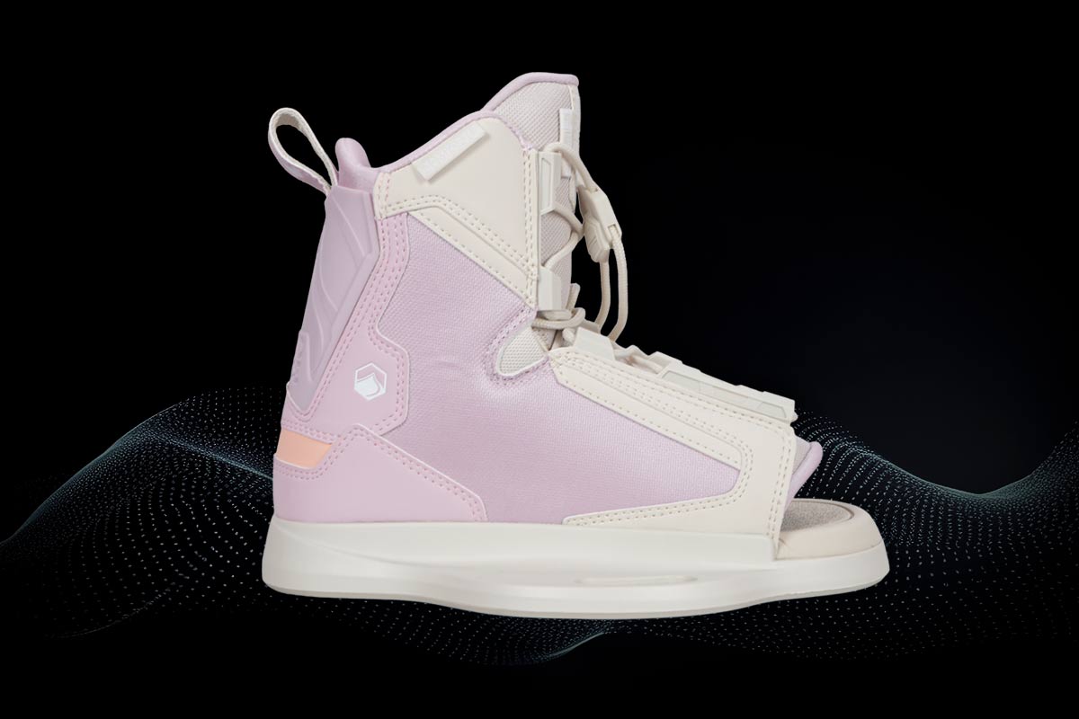 Pink and white wakeboard binding on a black background
